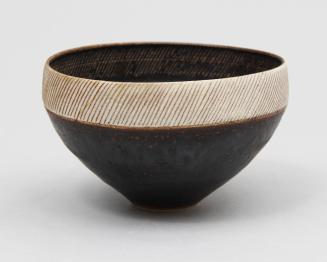 Dark brown and cream bowl with sgraffito