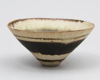 White bowl with three bands of brown glaze