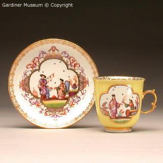 Coffee cup and saucer with chinoiserie design