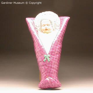Figure of a child in swaddling