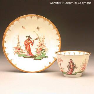 Tea bowl and saucer with chinoiseries