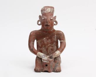 Figure of a Seated Drummer