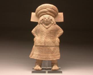 Standing female figure with 'huipil' and skirt