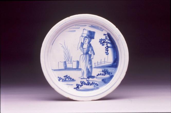 Plate with woman supporting a bucket