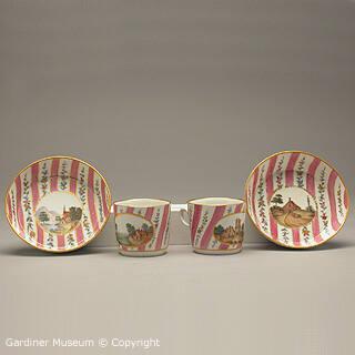 Pair of cups and saucers with landscapes