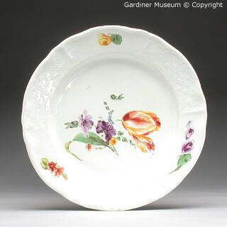 Plate with moulded flowers
