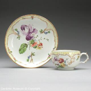 Teacup and saucer with flowers and stripes