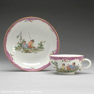 Teacup and saucer with scene of two peasants