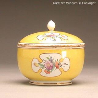 Sugar bowl with flowers on a yellow ground