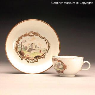Cup and saucer with landscapes