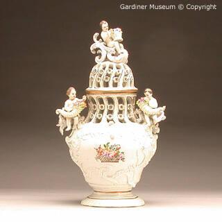 Potpourri vase with cherubs and flowers