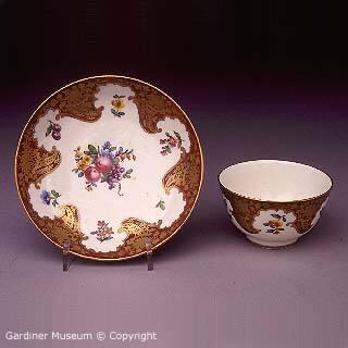Tea bowl and saucer with 'Claret' ground