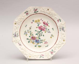 Plate with moulded prunus pattern