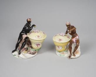 Pair of Nubian figure sweetmeat dishes