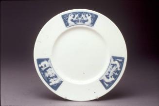 Plate with 'pâte-sur-pâte' panels by Alboin Birks, unfinished