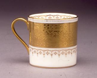 Coffee can with acid-etched gold pattern