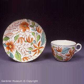 Teacup and saucer with chinoiserie pattern