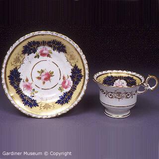 Coffee cup and saucer with roses