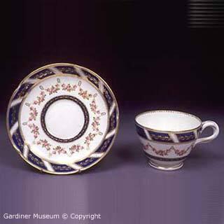 Teacup and saucer with Sèvres style rose pattern