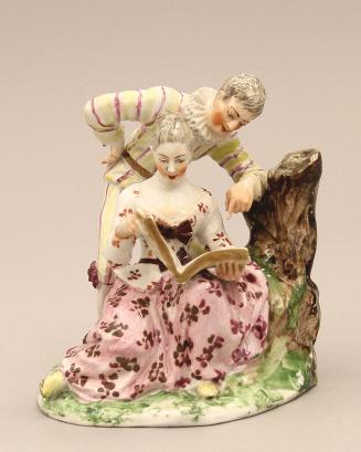 Figural group of singers reading music