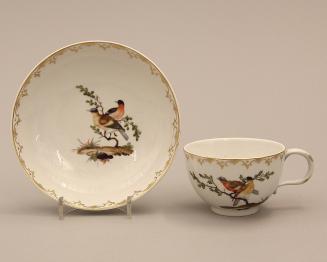 Cups and saucers with songbirds