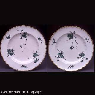 Pair of plate painted with florals in green camaieu