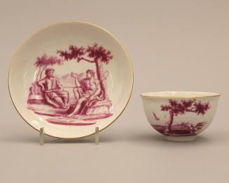 Cup and saucer with classical scene