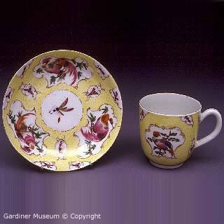Coffee-cup and saucer, yellow-ground with exotic birds