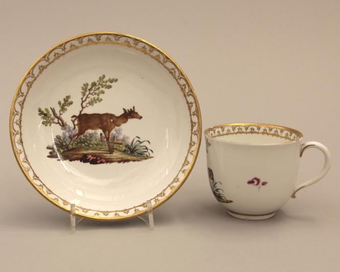 Cup and saucer with hunting dog