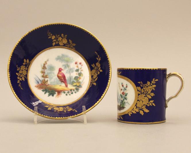 Cup and saucer with polychrome birds