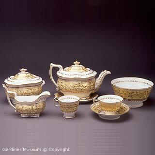 Partial tea service with stylized floral pattern