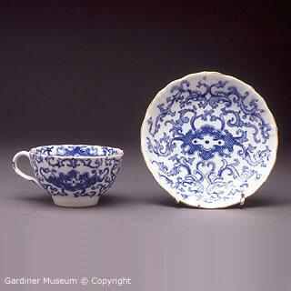 Cup and saucer with printed dragon design