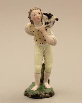 Figure of a man carrying a sheep