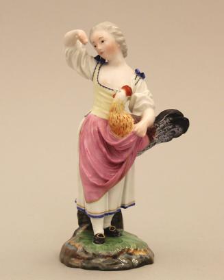 Figure of a woman holding a rooster