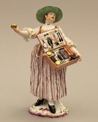 Figure of a trinket seller